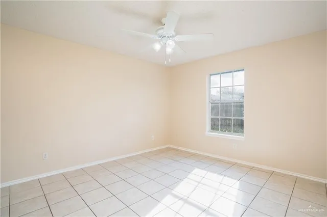 a bathroom with a granite countertop sink a mirror and a toilet