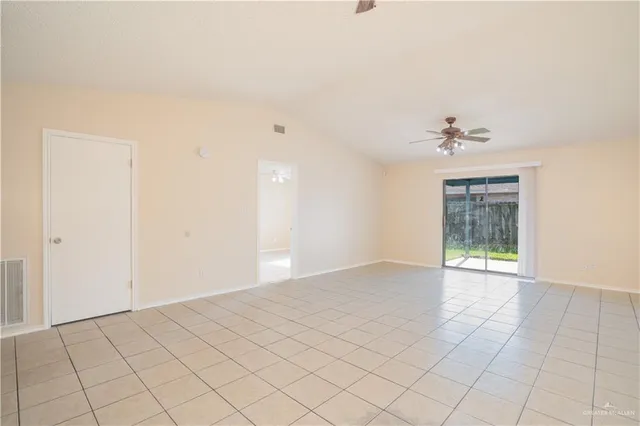 a kitchen with a refrigerator and a stove top oven