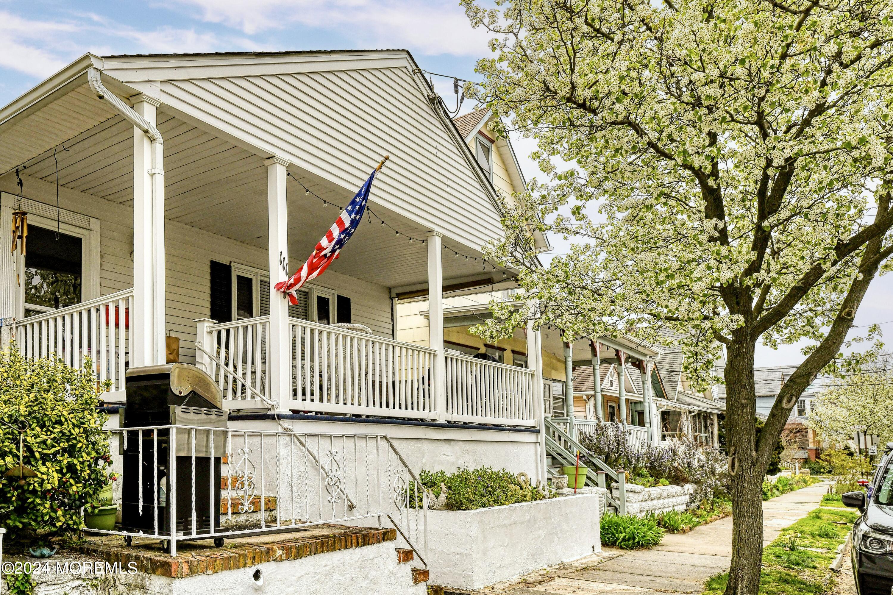 111 Cookman Avenue Ocean Grove, NJ 07756 - Photo 1 of 8 a front view of a house with a yard
