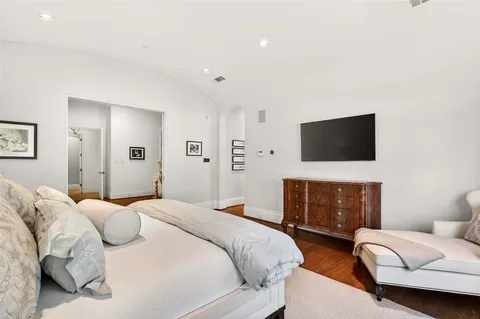 a spacious bathroom with a granite countertop tub shower and mirror