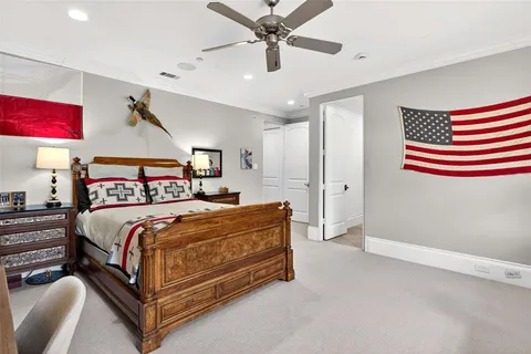 a bedroom with a bed couch and window