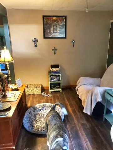 a bedroom with a bed and a flat screen tv