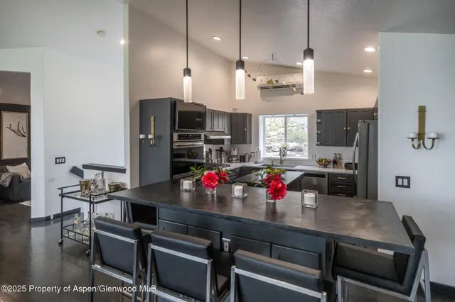 a utility room with sink dryer and washer