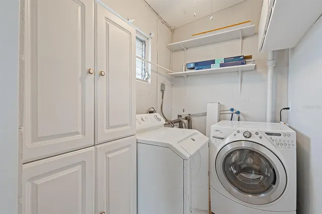a utility room with dryer and washer