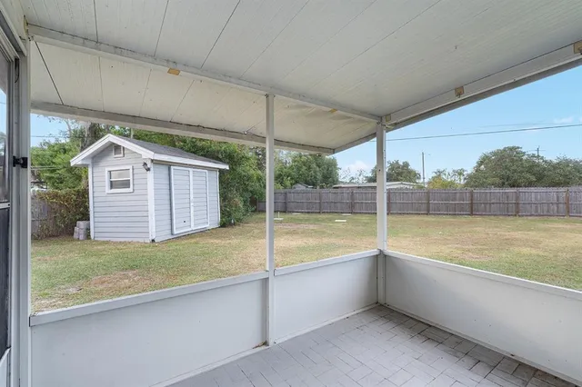 a view of a bathtub in a room next to a yard