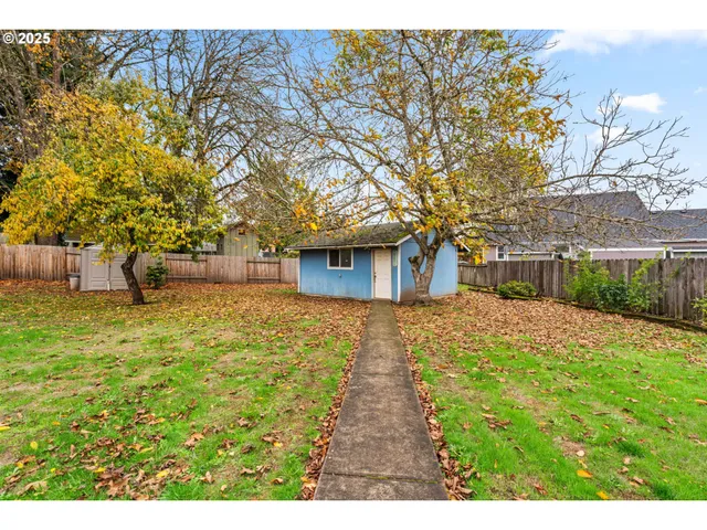 a building outdoor space with patio furniture and potted plants