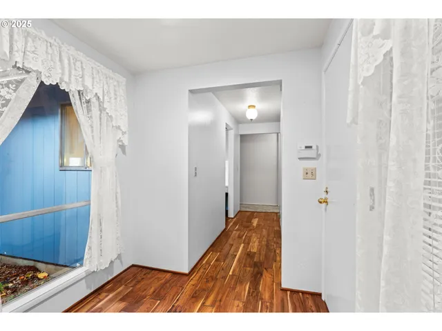 a kitchen with a sink cabinets and window