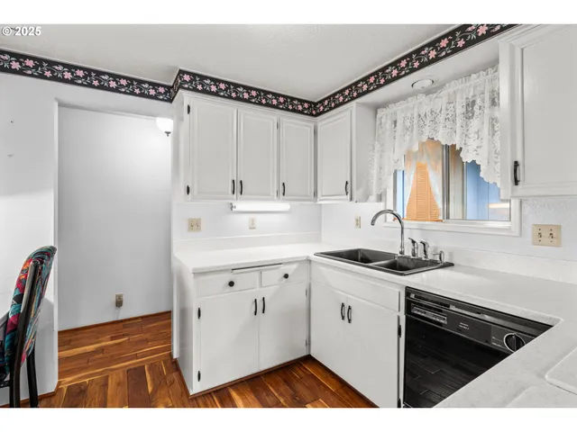 a living room with furniture a window and a fireplace