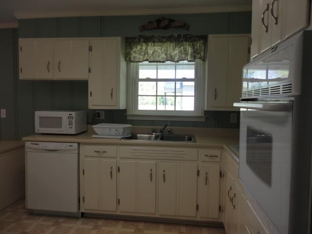 464 Elora Road Elora, TN 37328 - Photo 8 of 20 a kitchen with white cabinets and sink
