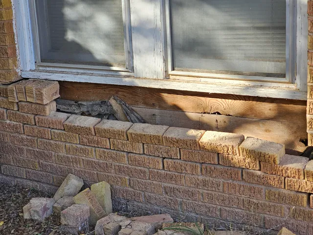 a bathroom with a bathtub and a window