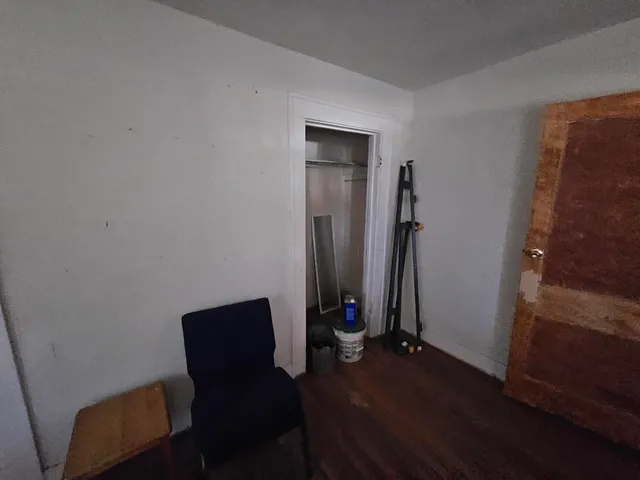 a view of workspace with wooden floor and windows