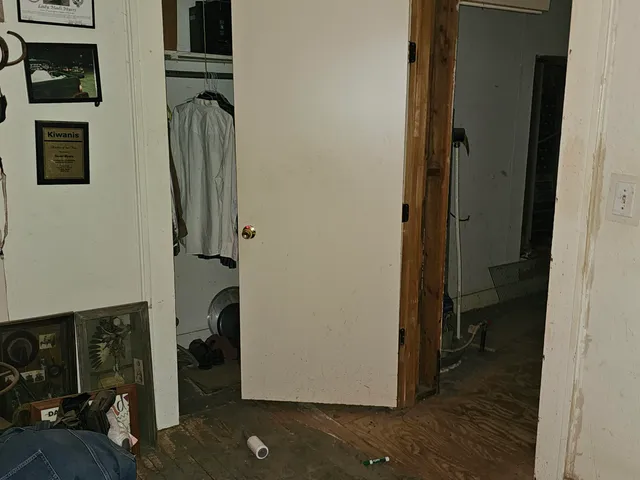 a view of a bedroom from a hallway