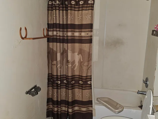 a bathroom with a bathtub and sink