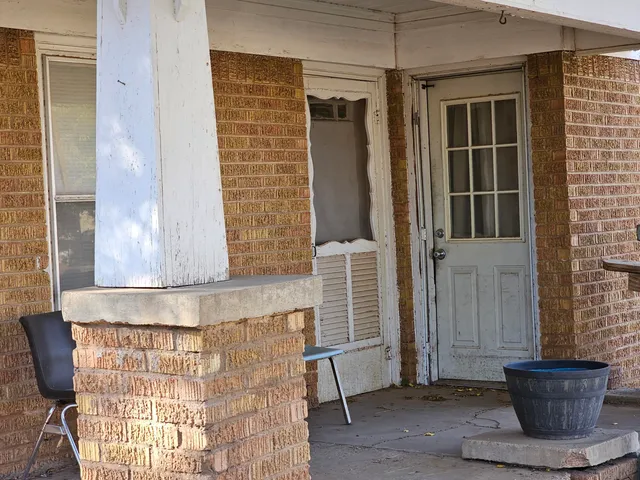 a view of a door and chair in the porch