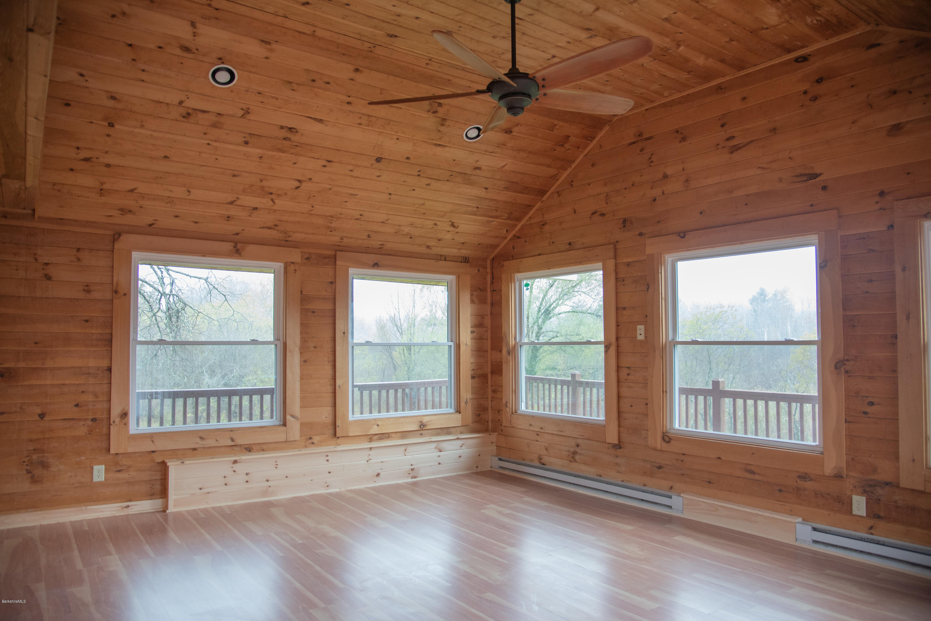 518 Swamp Road Richmond, MA 01201 - Photo 14 of 23 a view of an empty room with wooden floor and a window