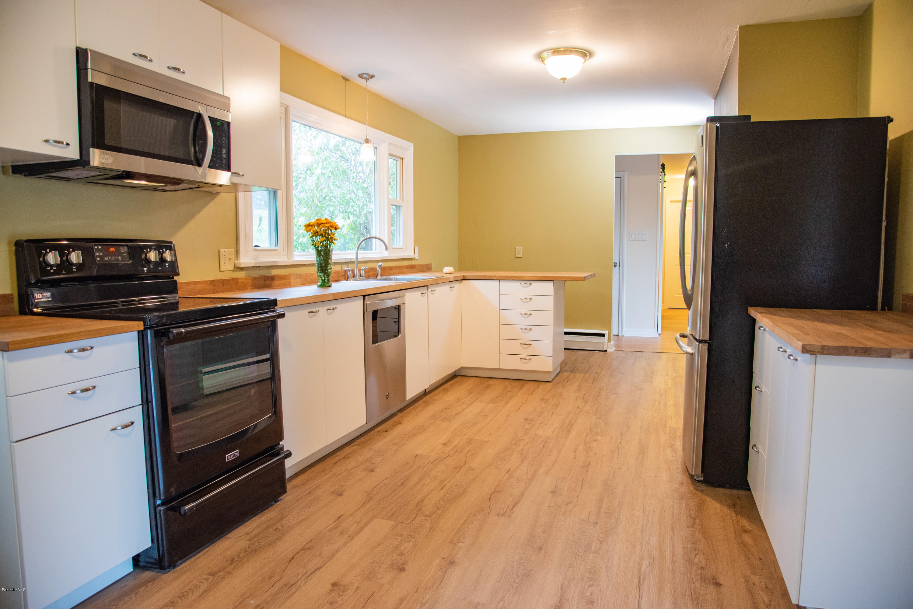 518 Swamp Road Richmond, MA 01201 - Photo 3 of 23 a kitchen with stainless steel appliances a refrigerator stove and sink