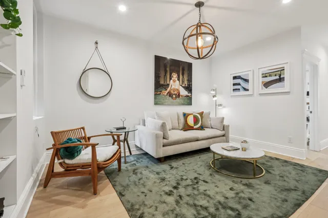 a living room with furniture and a table