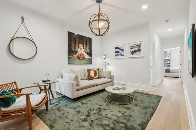 a living room with furniture and a table