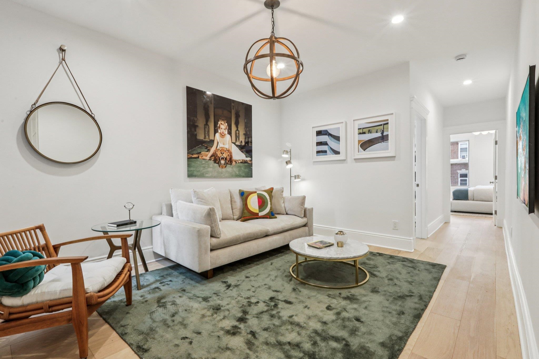 97 Clifton Terrace, Unit 6 Weehawken, NJ 07086 - Photo 2 of 36 a living room with furniture and a table