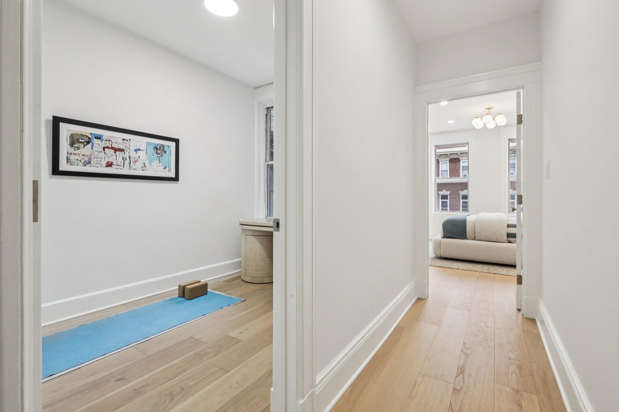 97 Clifton Terrace, Unit 6 Weehawken, NJ 07086 - Photo 26 of 36 a view of a hallway with wooden floor and closet
