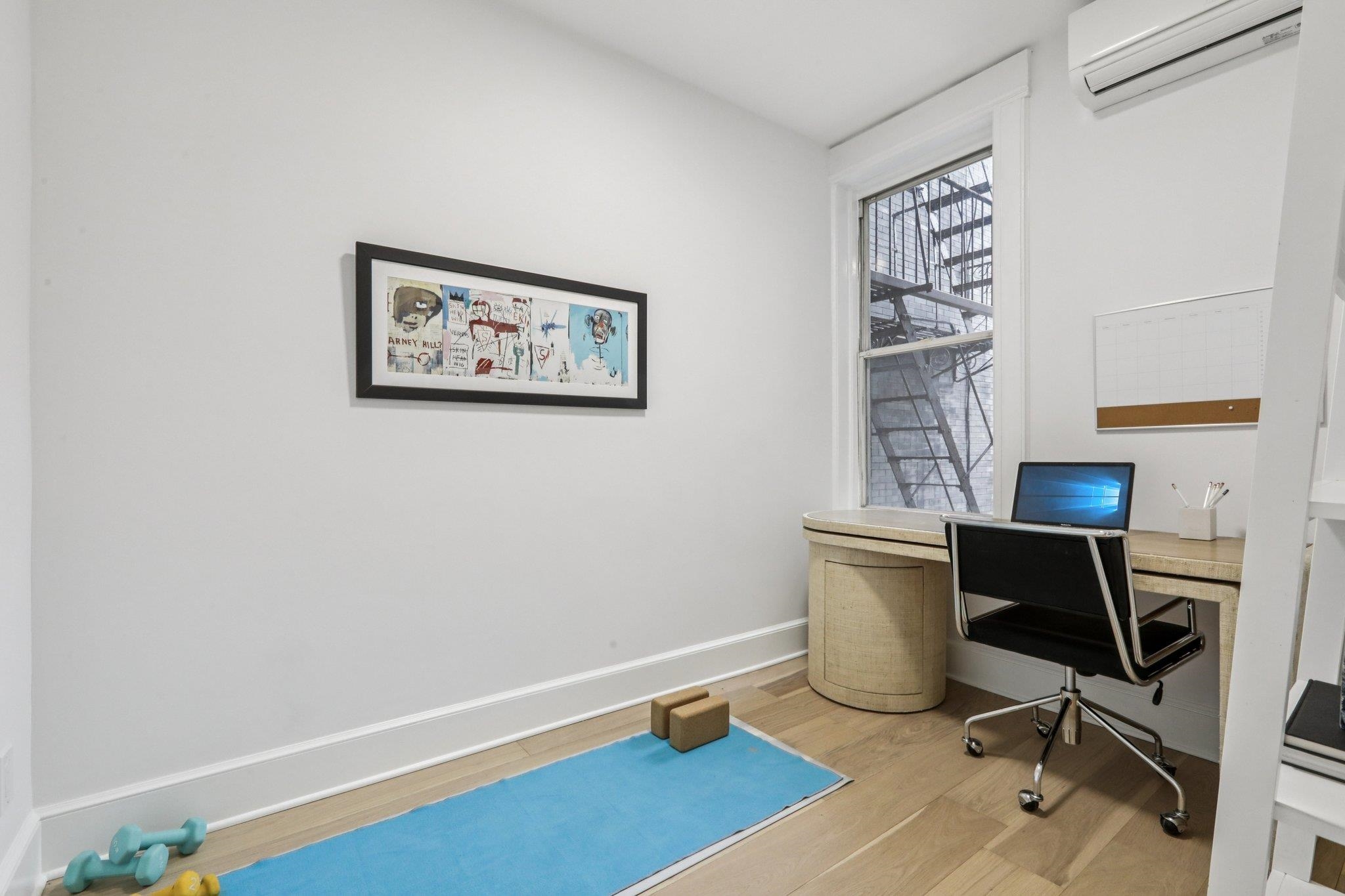 97 Clifton Terrace, Unit 6 Weehawken, NJ 07086 - Photo 27 of 36 a view of a workspace with furniture and a window