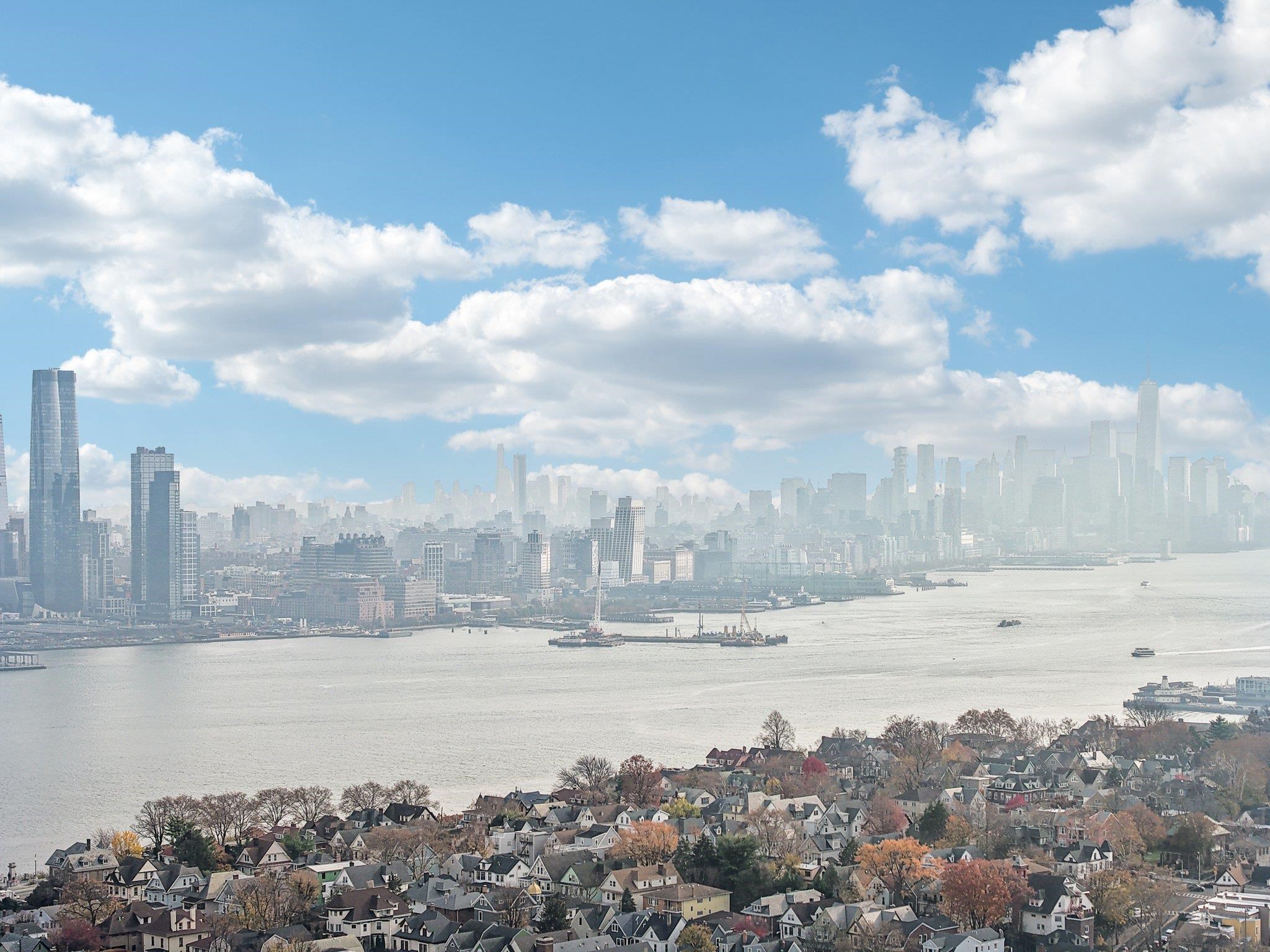 97 Clifton Terrace, Unit 6 Weehawken, NJ 07086 - Photo 32 of 36 a view of a lake and a building