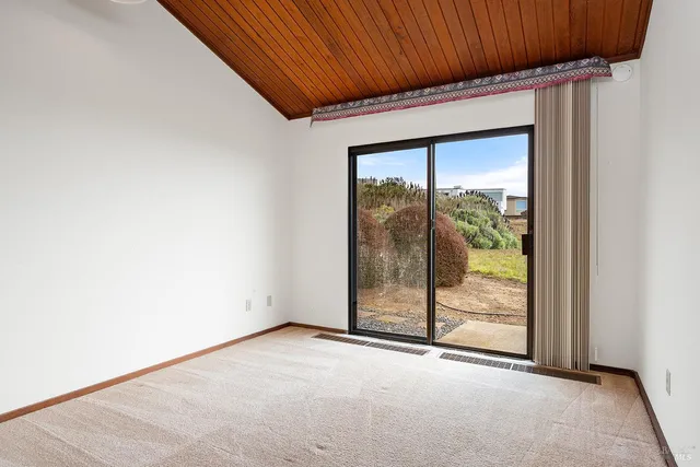 a view of a room with sliding glass door