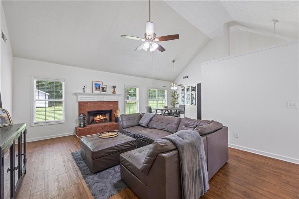 2630 Track Way Dacula, GA 30019 - Photo 12 of 27 a living room with furniture and a fireplace