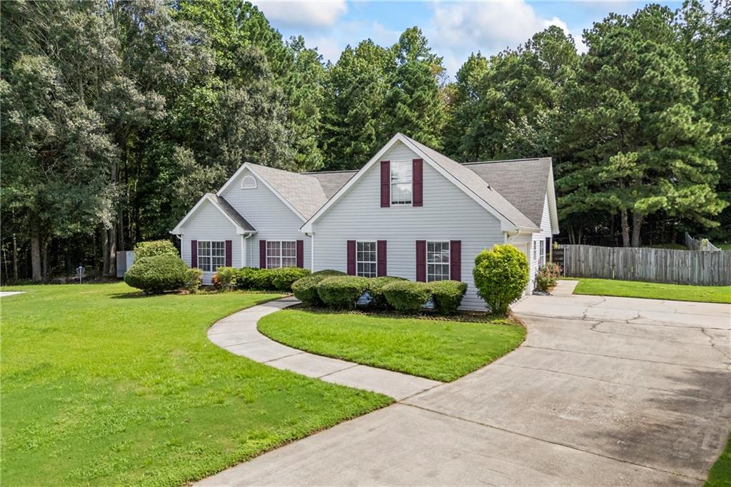 2630 Track Way Dacula, GA 30019 - Photo 2 of 27 a view of a yard in front of house