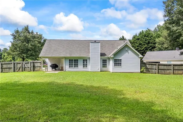 a view of house of outdoor space and yard