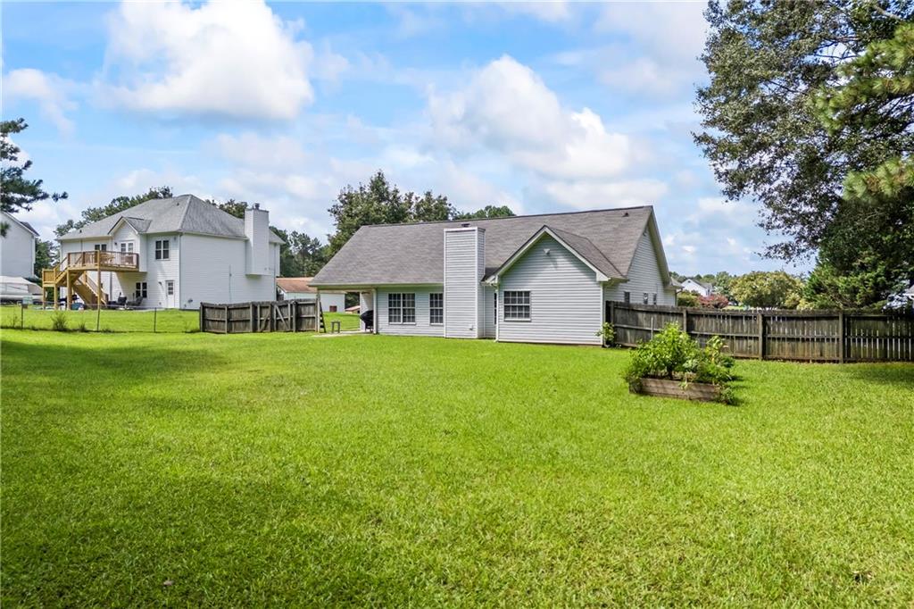 2630 Track Way Dacula, GA 30019 - Photo 24 of 27 a aerial view of a house with backyard and garden