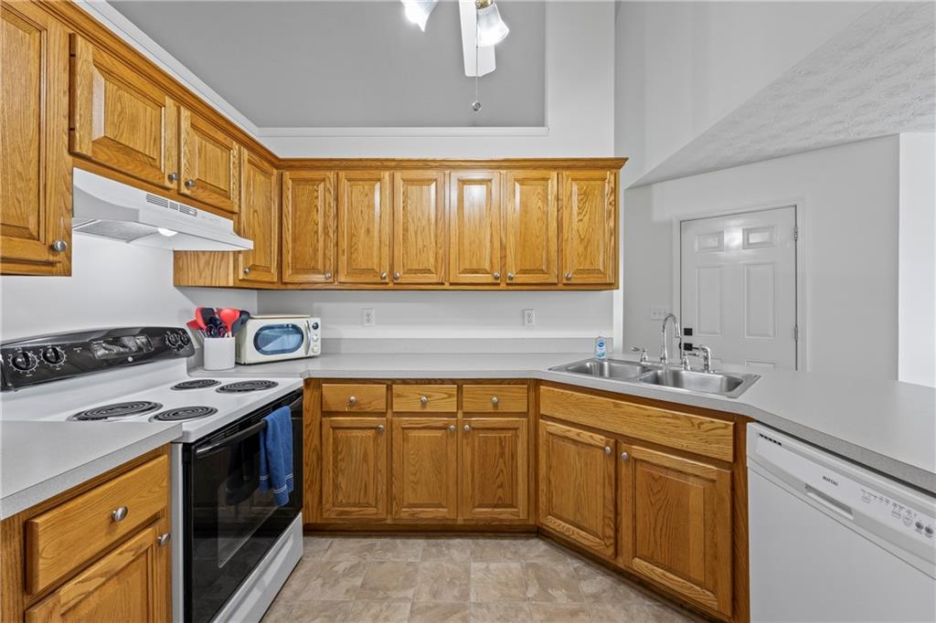 2630 Track Way Dacula, GA 30019 - Photo 5 of 27 a kitchen with a sink stove and cabinets