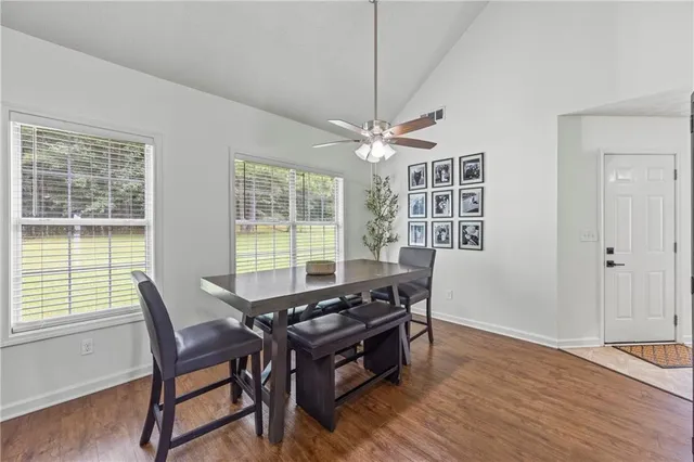 a view of a dining room with furniture window and wooden floor