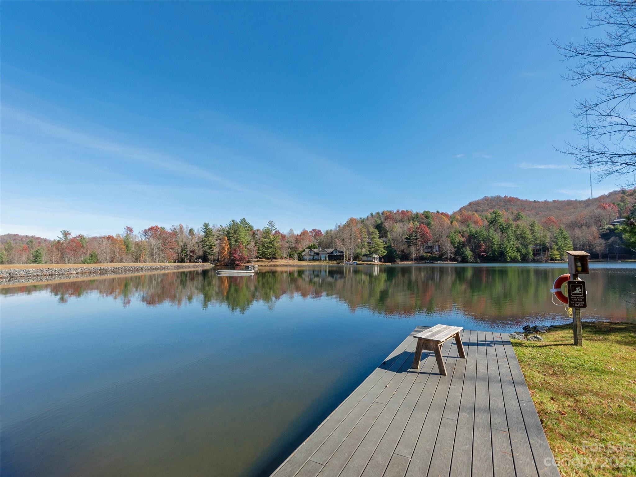 0 Walnut Ridge Road Brevard, NC 28712 - Photo 17 of 18 a wooden pier with boats in a lake