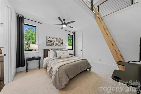 a bedroom with a large bed and a window