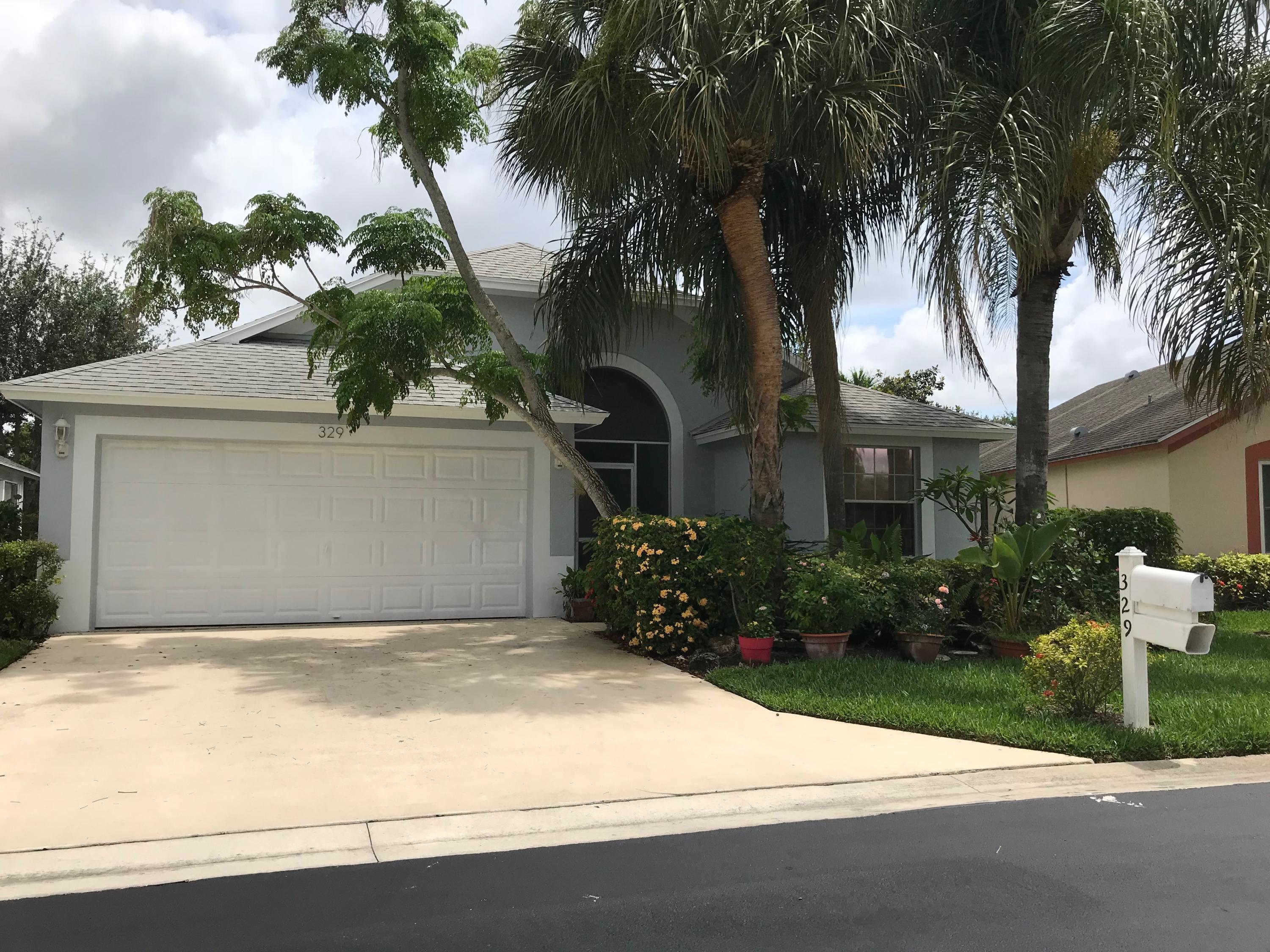 329 Hammocks Trail Greenacres, FL 33413 - Photo 2 of 28 2 CAR GARAGE