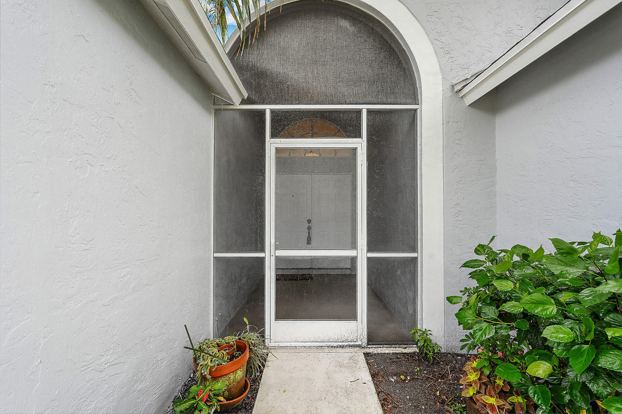 329 Hammocks Trail Greenacres, FL 33413 - Photo 6 of 28 ENTRY WALKWAY