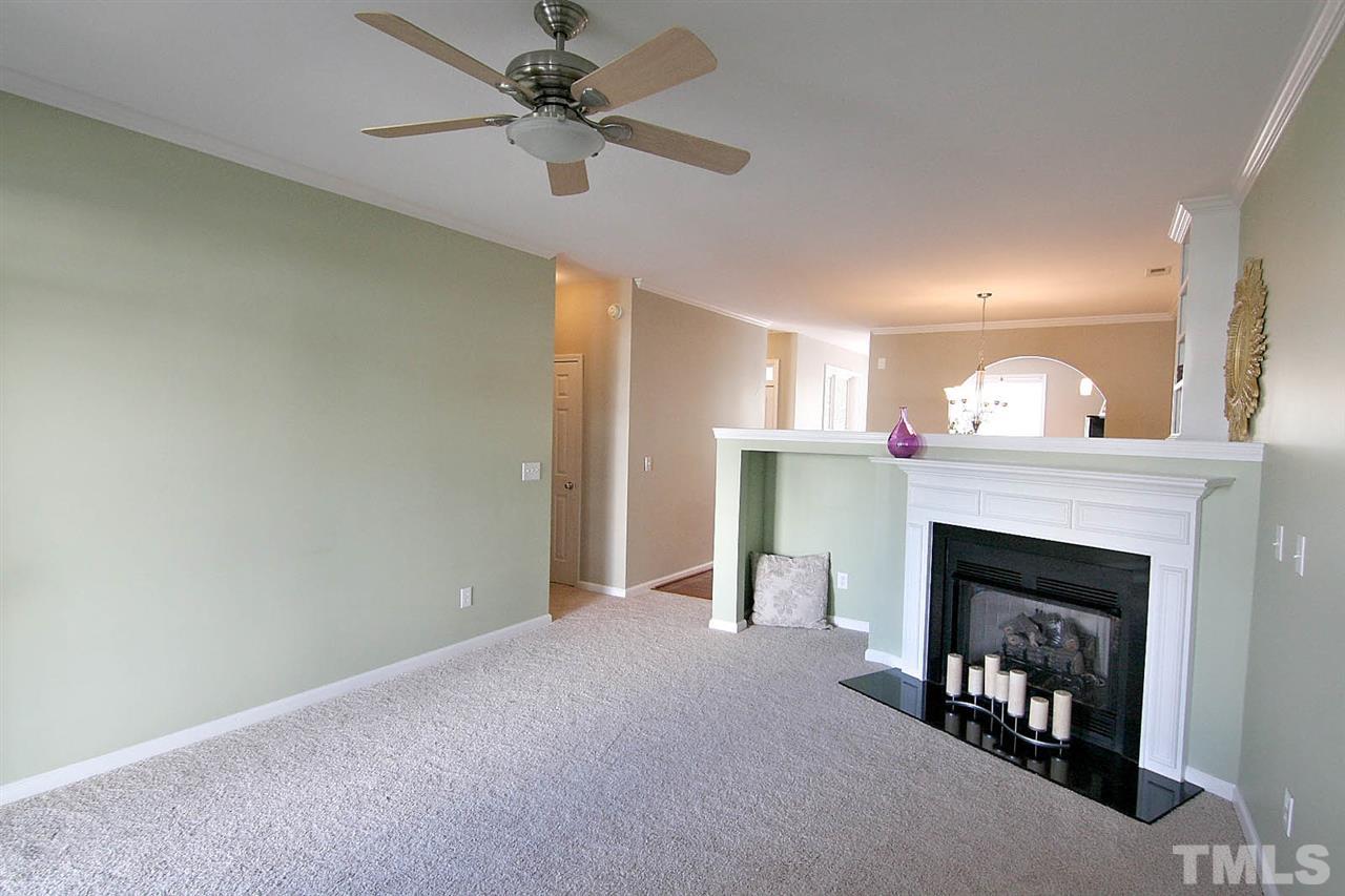 11122 Slider Drive Raleigh, NC 27614 - Photo 3 of 24 Cozy family room with gas log fireplace.