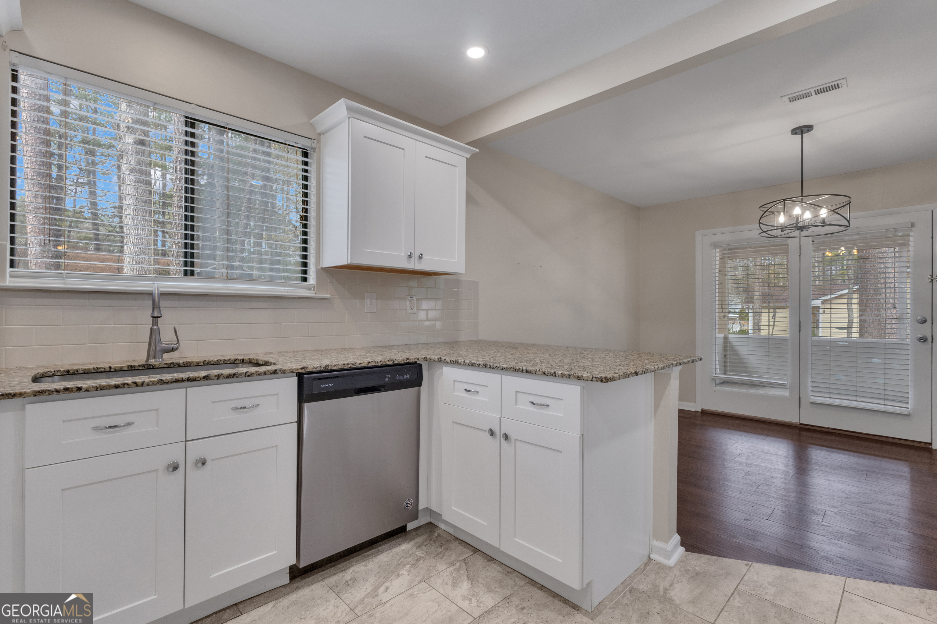 101 Dove Rise Peachtree City, GA 30269 - Photo 14 of 41 a kitchen that has a lot of cabinets in it with granite countertop stainless steel appliances