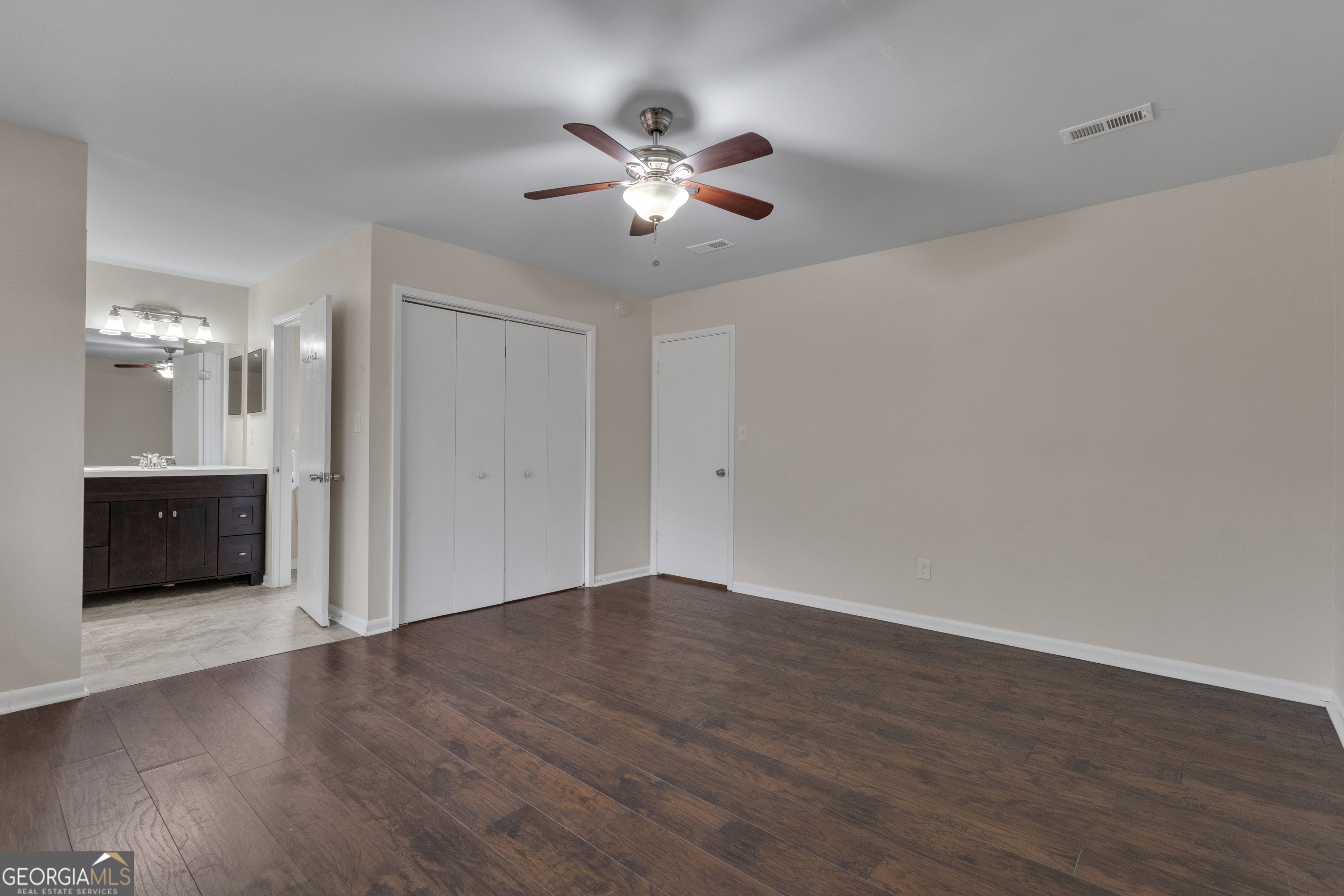 101 Dove Rise Peachtree City, GA 30269 - Photo 20 of 41 a view of a livingroom with a chandelier fan and wooden floor
