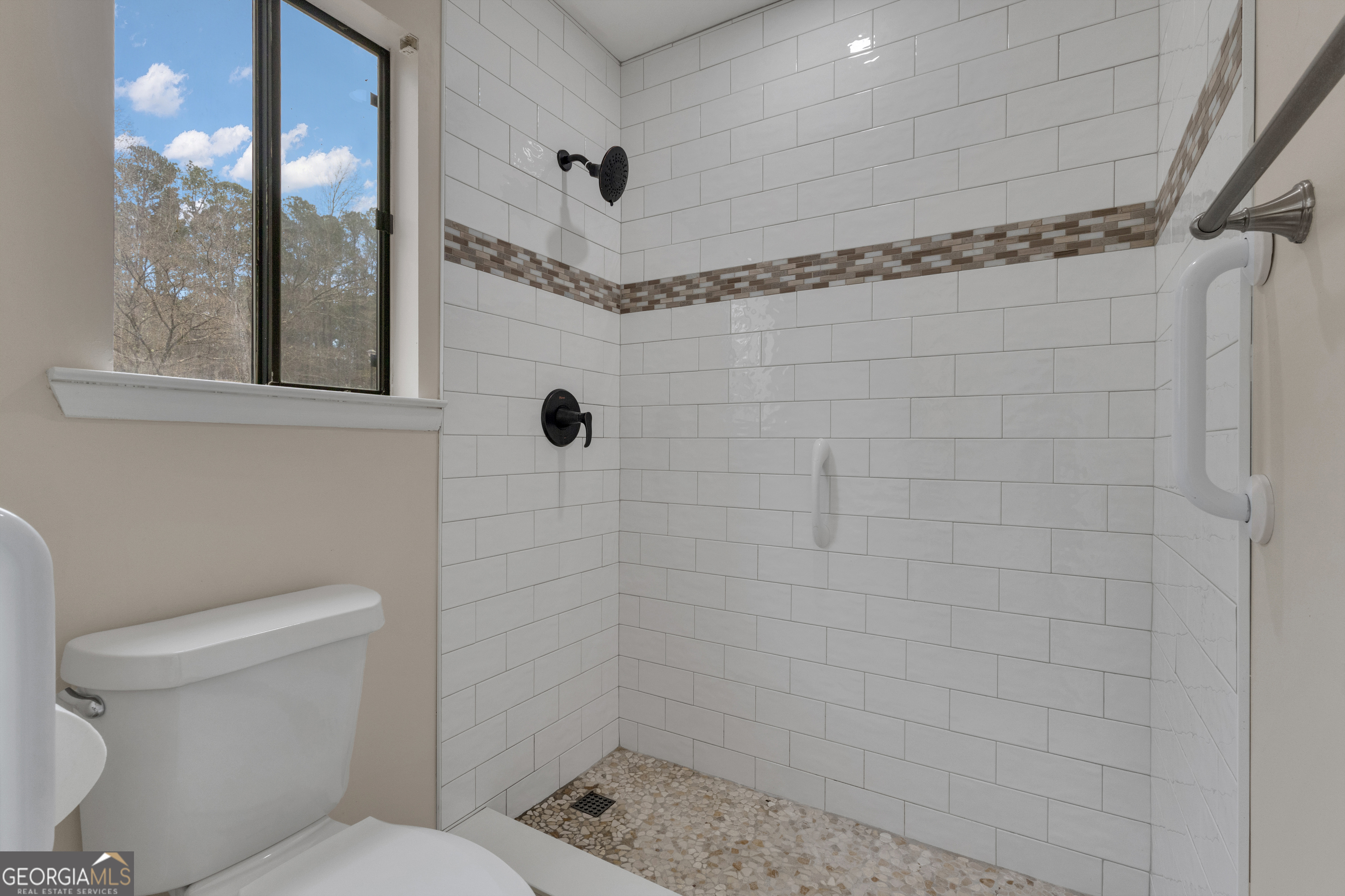 101 Dove Rise Peachtree City, GA 30269 - Photo 24 of 41 a bathroom with a toilet and shower
