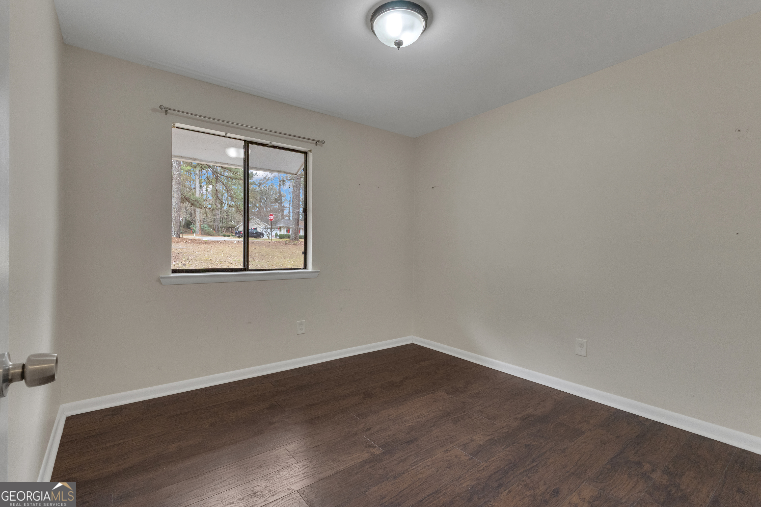101 Dove Rise Peachtree City, GA 30269 - Photo 28 of 41 an empty room with wooden floor and windows