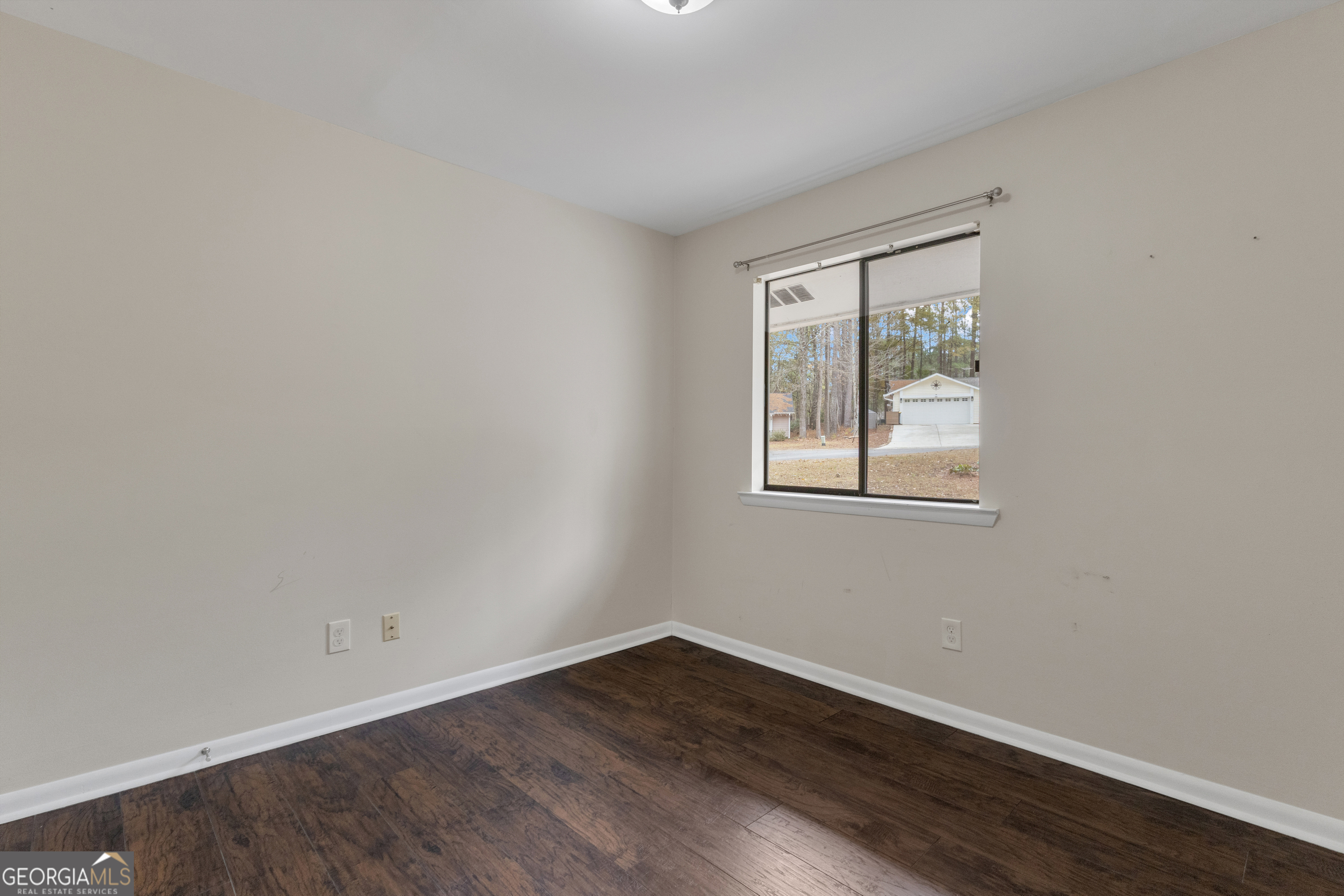101 Dove Rise Peachtree City, GA 30269 - Photo 30 of 41 a view of an empty room with wooden floor and a window