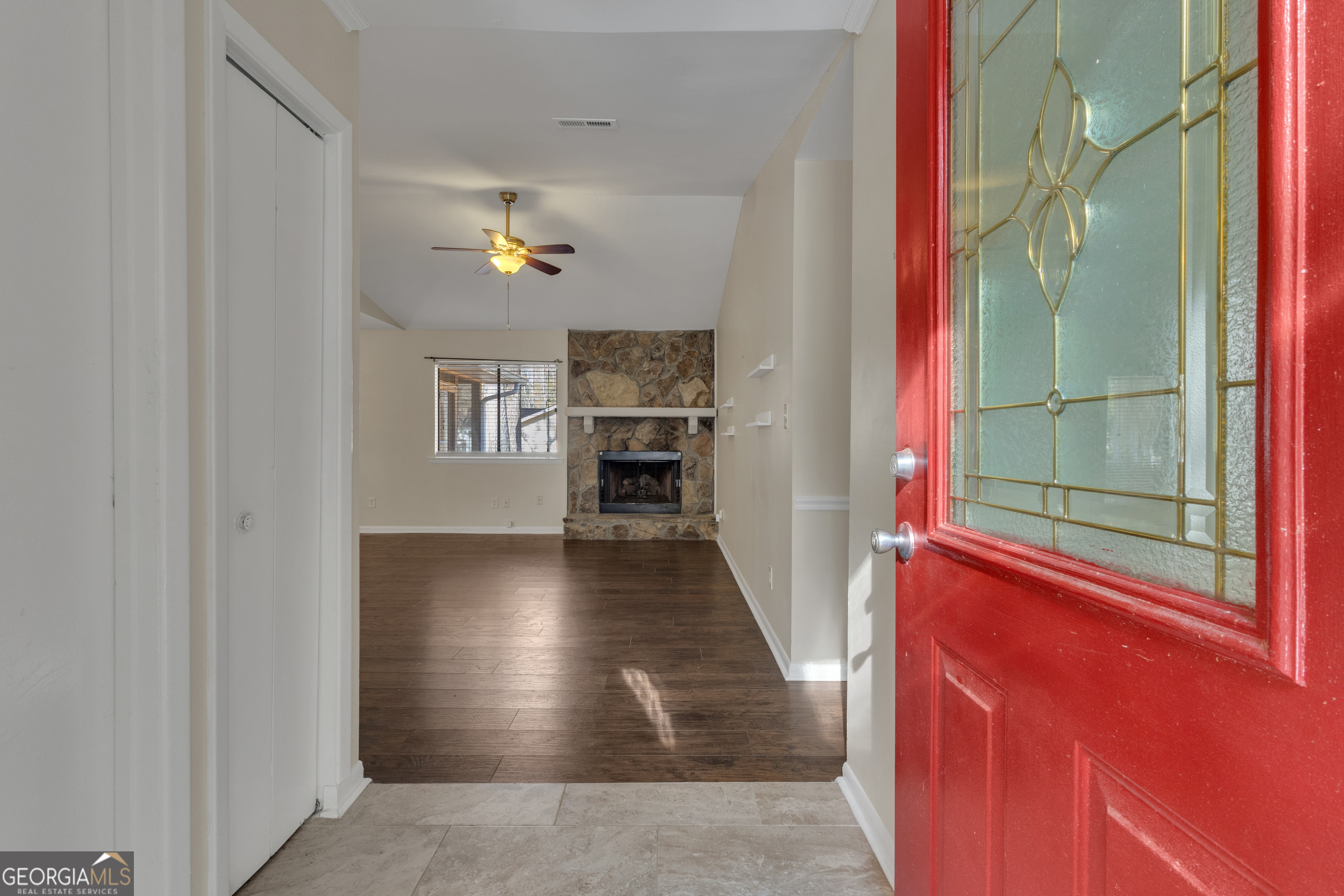101 Dove Rise Peachtree City, GA 30269 - Photo 3 of 41 a view of a hallway with wooden floor and a living room