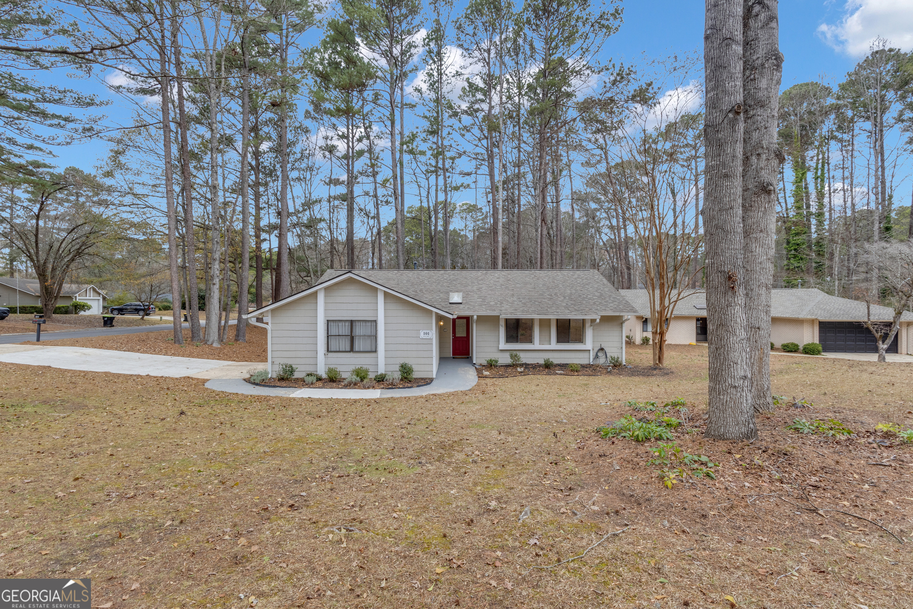 101 Dove Rise Peachtree City, GA 30269 - Photo 39 of 41 a view of a large house with a large tree next to a yard