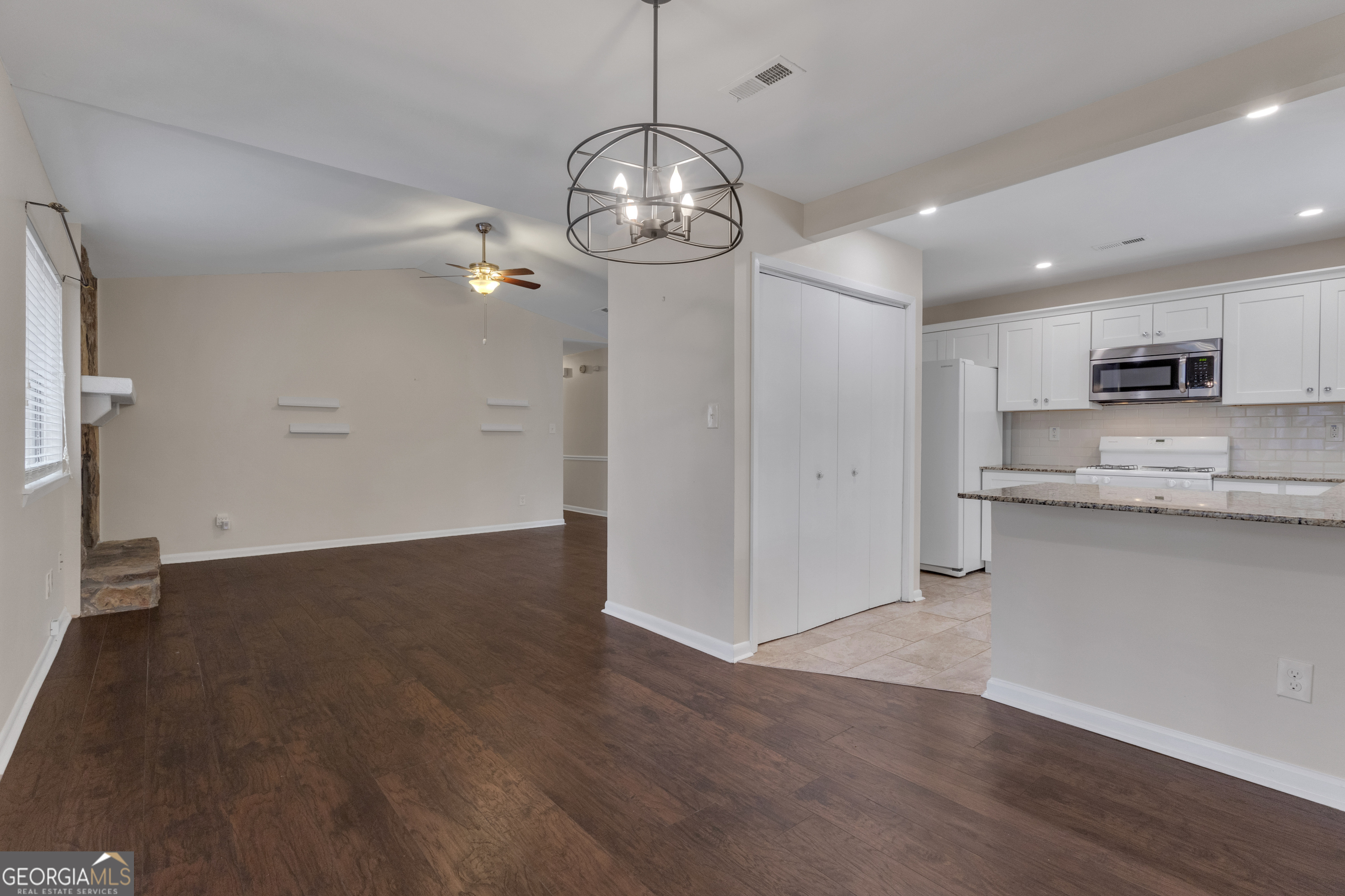 101 Dove Rise Peachtree City, GA 30269 - Photo 9 of 41 a view of a kitchen with a sink and microwave
