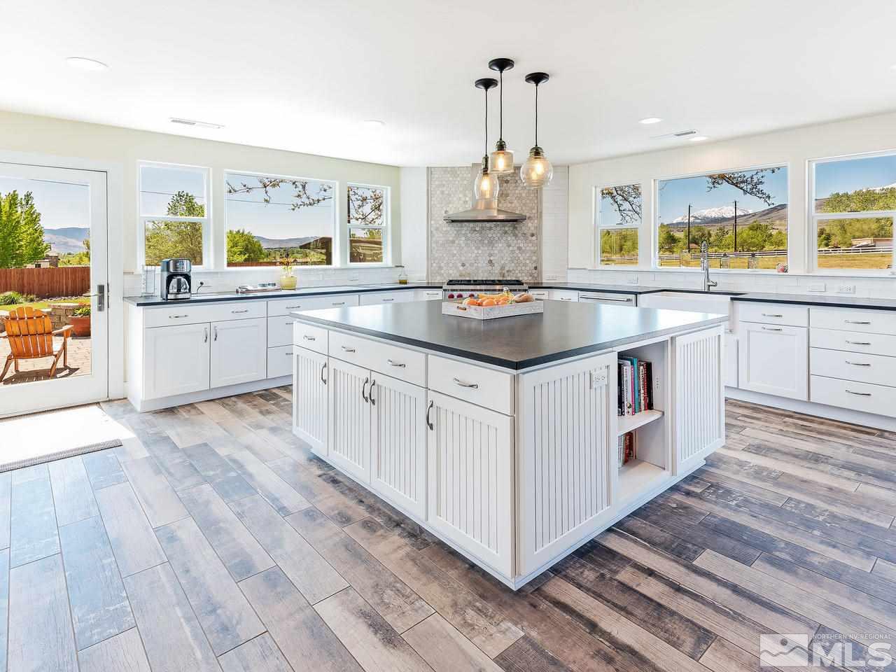 1700 Davis Lane Reno, NV 89511 - Photo 7 of 25 a kitchen with stainless steel appliances granite countertop a stove and a sink