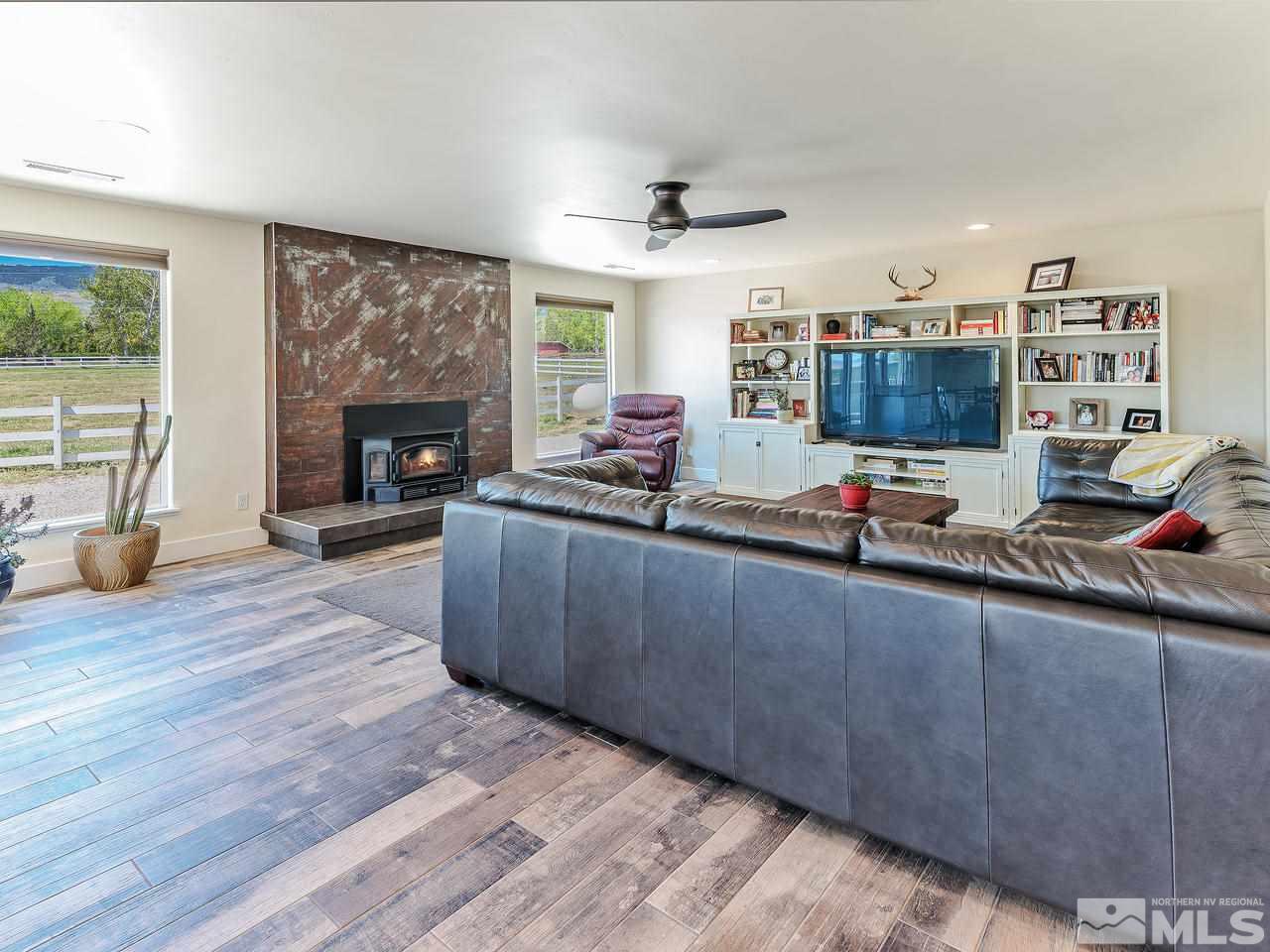 1700 Davis Lane Reno, NV 89511 - Photo 10 of 25 a living room with furniture and a fireplace