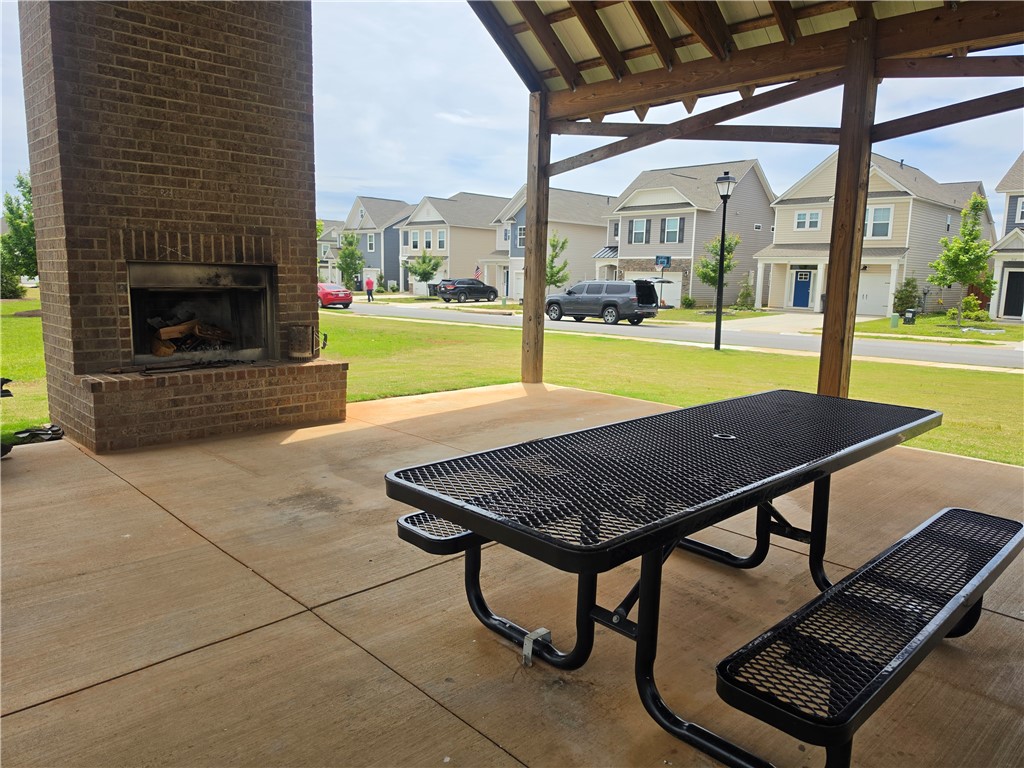 312 Phillips Drive Pendleton, SC 29670 - Photo 42 of 45 This community gathering space features a brick fireplace for cozy evenings.