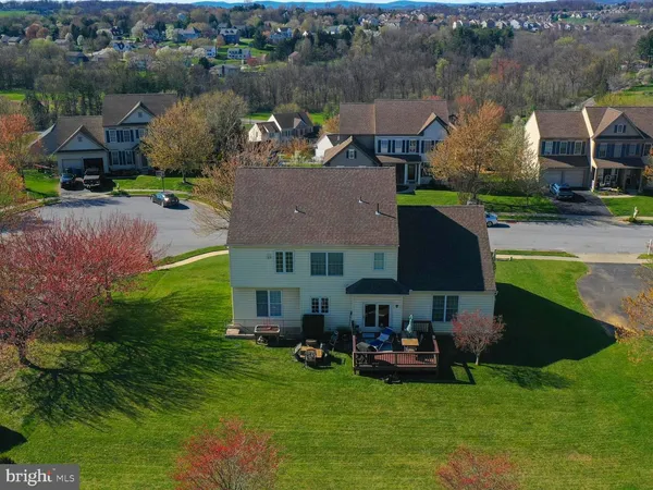 an aerial view of a house with outdoor space
